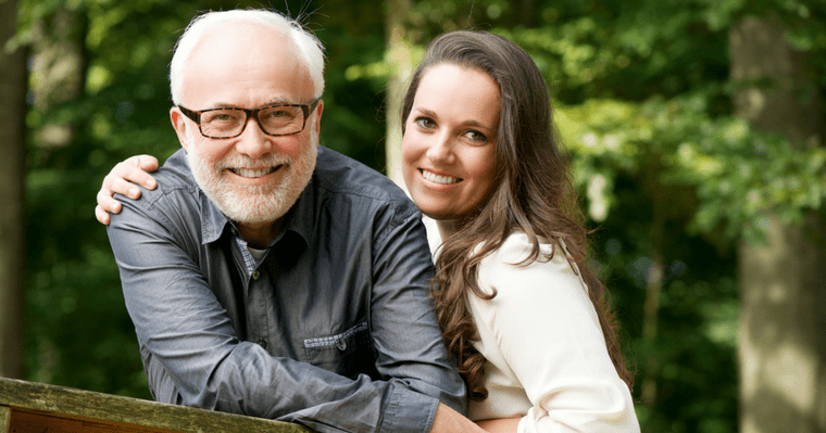 An older couple smiling with non-metal implants from Kirkland Dentist Dr. Shawn Keller